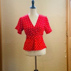 Red and white polka dot blouse